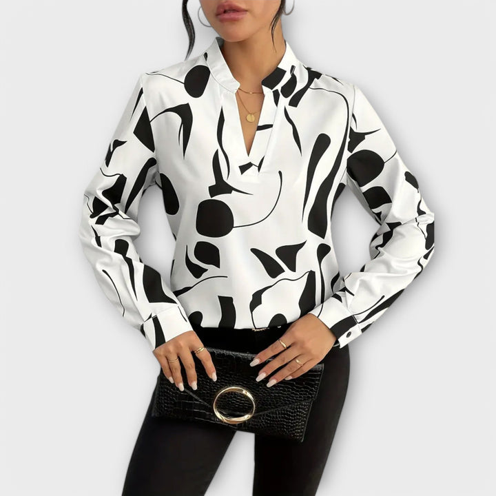 Elegant langærmet bluse med spids halsudskæring